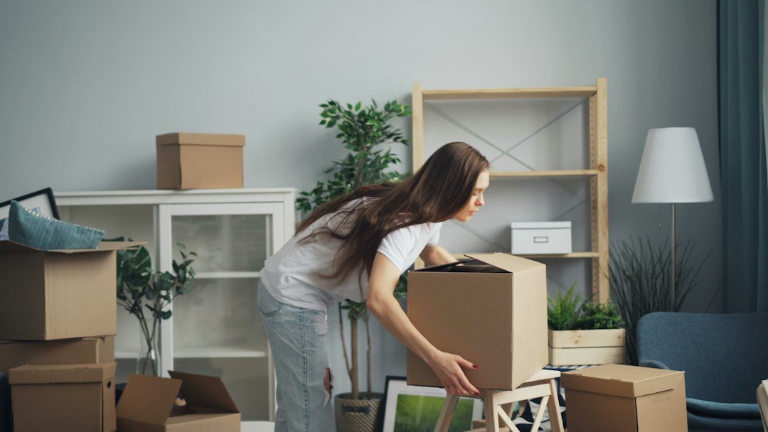 Illustrative image of packing moving boxes in a living room for Broomfield packing services